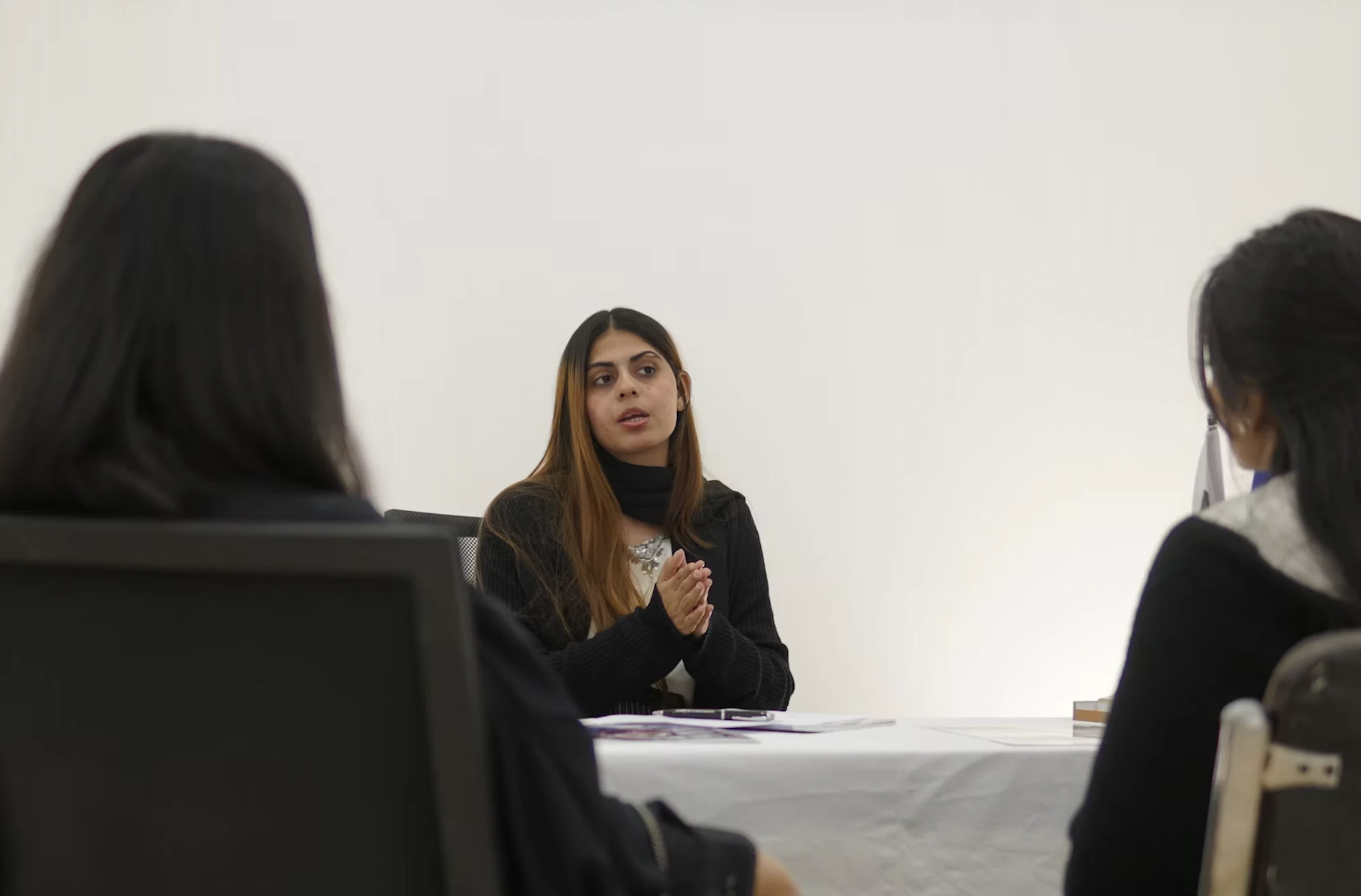 An IPS team member speaking during a meeting