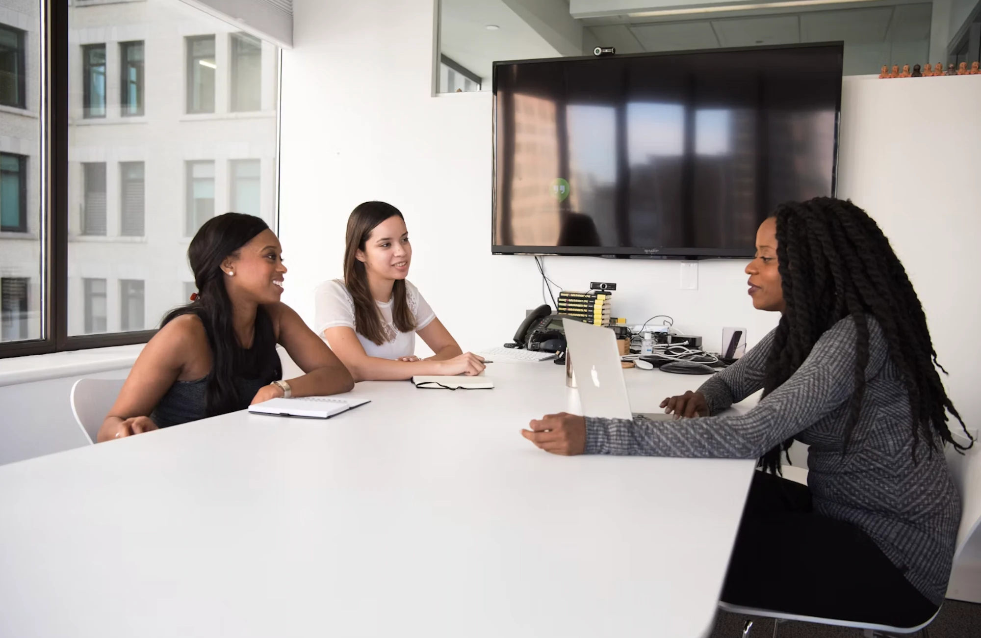 The IPS team meeting around a table